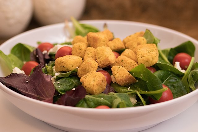 An image of croutons on a salad.