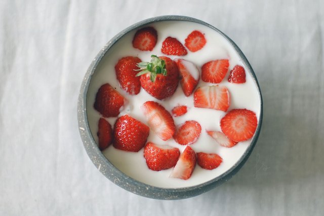 Fresh Strawberries in a bowl of coconut milk