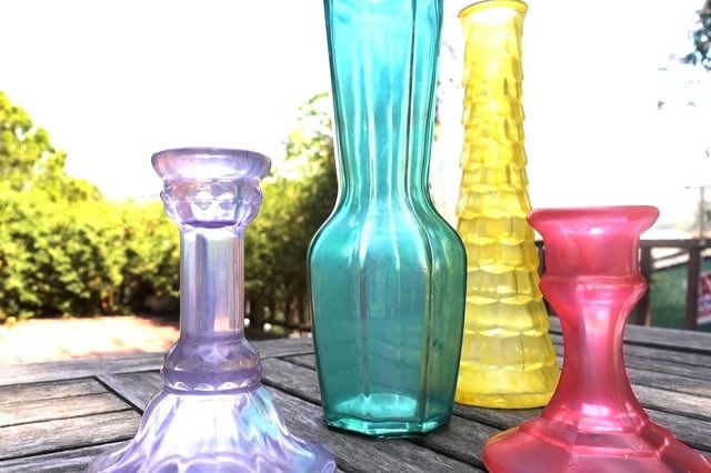Faux sea glass in purple, teal, yellow and pink takes effect on vintage vessels