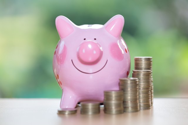 Piggy bank with growth coins which means grwoth business success concept