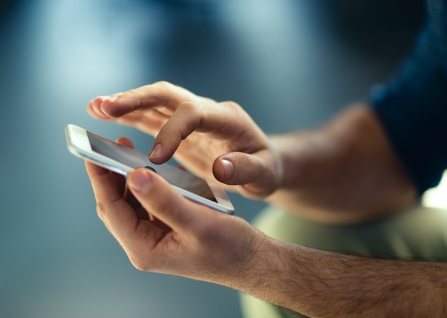 Hands using a smartphone