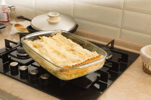 lasagna extracted from the oven in a glass container