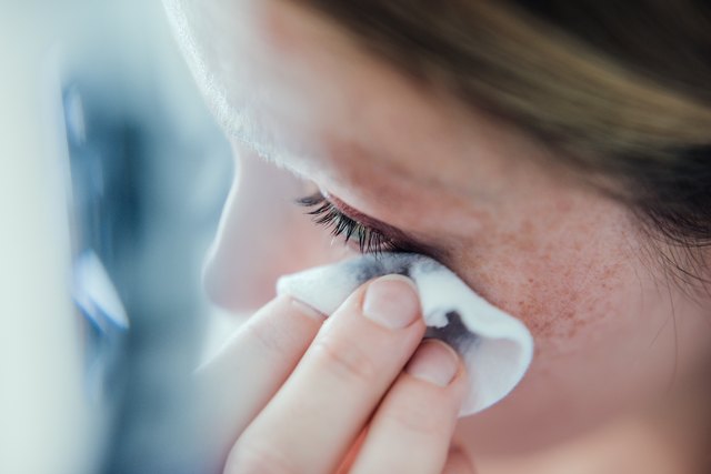 Woman removing make up.