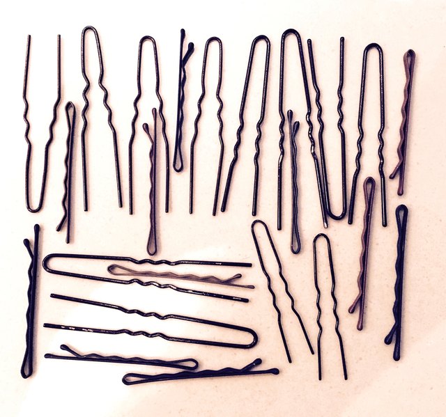 High Angle View Of Hairpins Against White Background