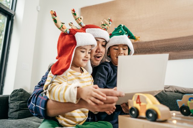 Dad and kids during Christmas holidays having fun at home