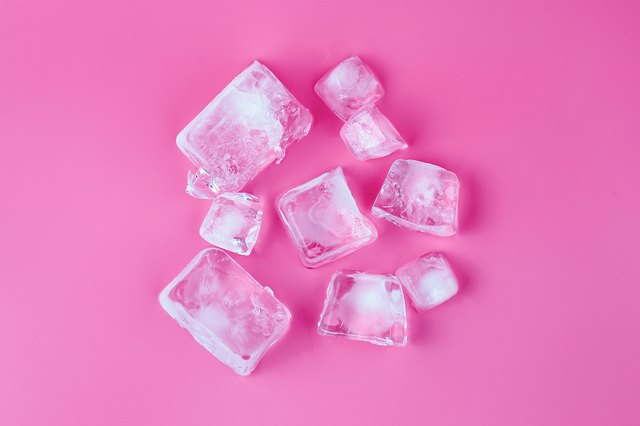 Directly Above Shot Of Ice Cubes Over Pink Background