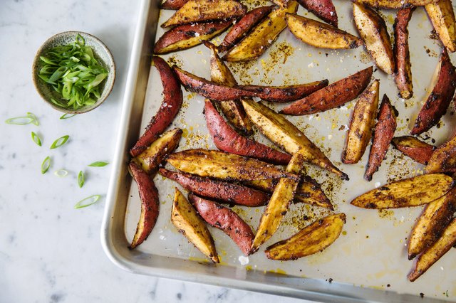 Overhead view of grilled sweet potatoes in baking pan on table