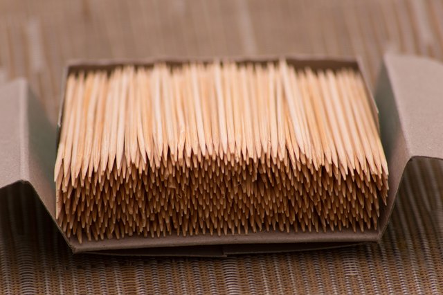 box of bamboo toothpicks on a table set