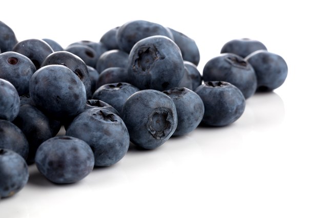 Fresh blueberries isolated on white background - close up