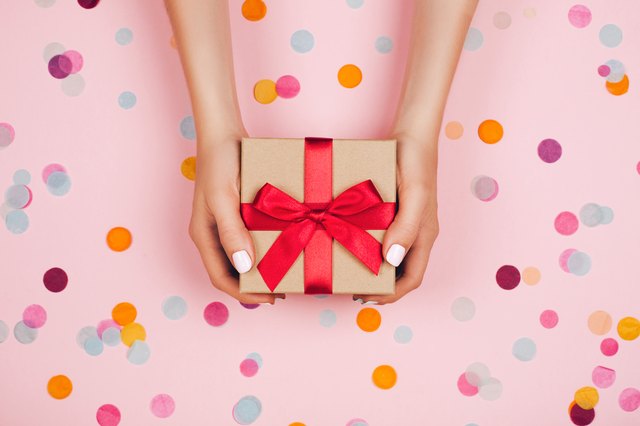 Hands holding present box