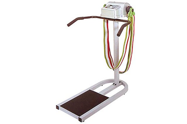 Portrait of man using exercise equipment in gymnasium