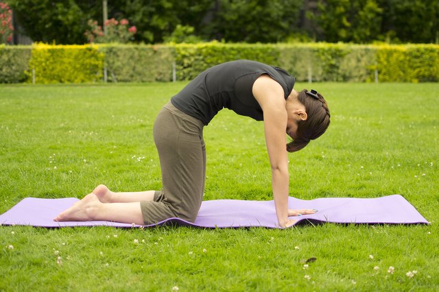 Woman doing yoga outdoors