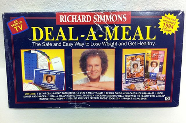 Portrait of man using exercise equipment in gymnasium