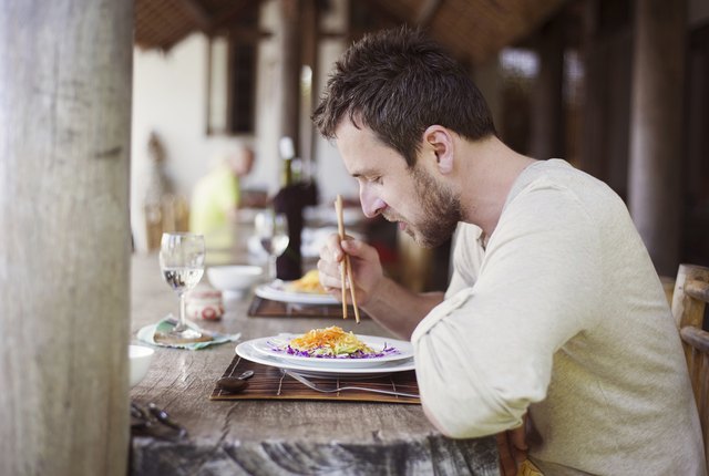 Man enjoying meal at vietnamese restaurant