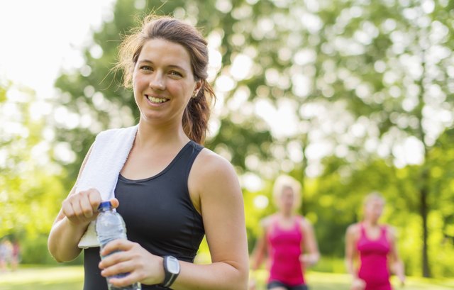 Healthy girl holding a water bottle