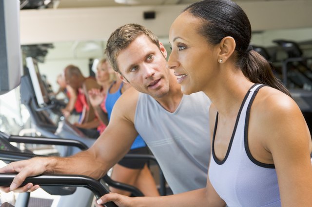 Personal Trainer Encouraging Woman