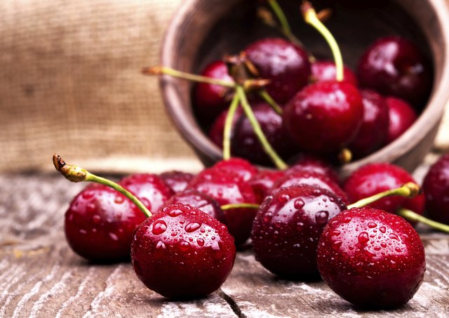 Cherries on wooden table