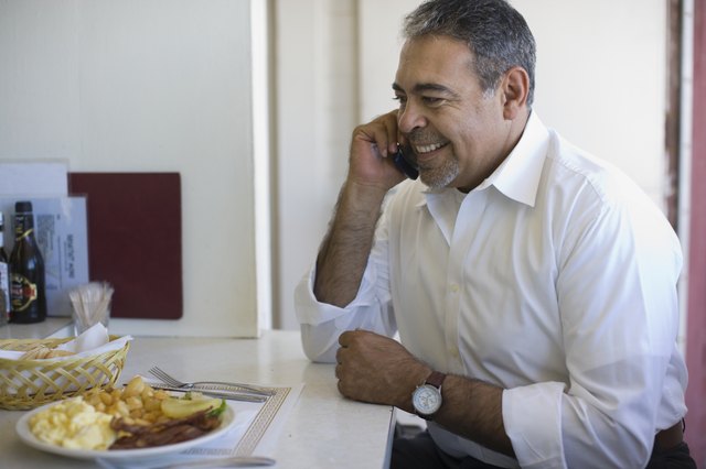 Hispanic man talking on cell phone