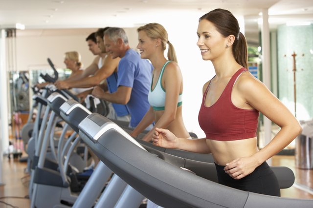 Woman On Running Machine In Gym