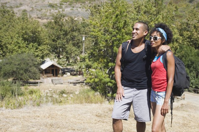 Couple checking the view from atop a hill