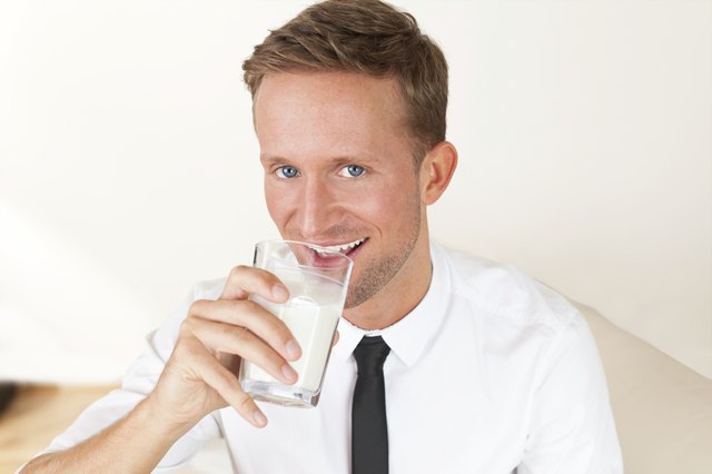young man drinking milk