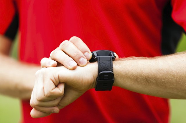 Runner looking at sport watch