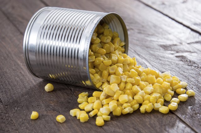 Corn on wooden background