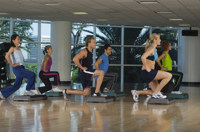 People Exercising in Step Aerobics Class