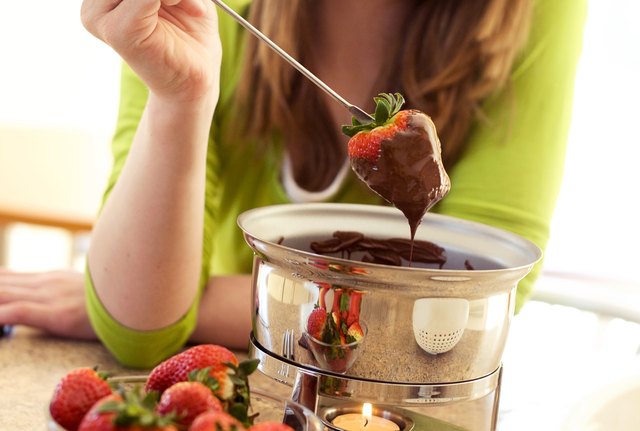 Strawberry dipped into melted dark chocolate