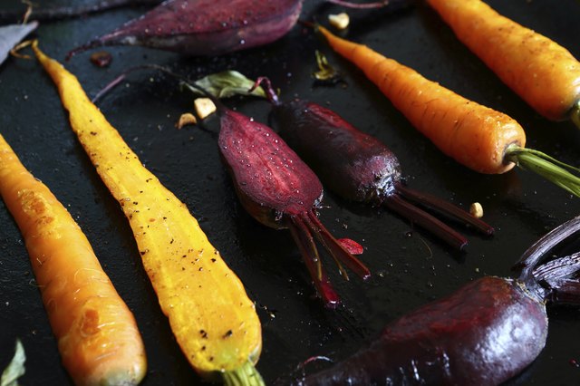 baked carrots and beets on baking sheet