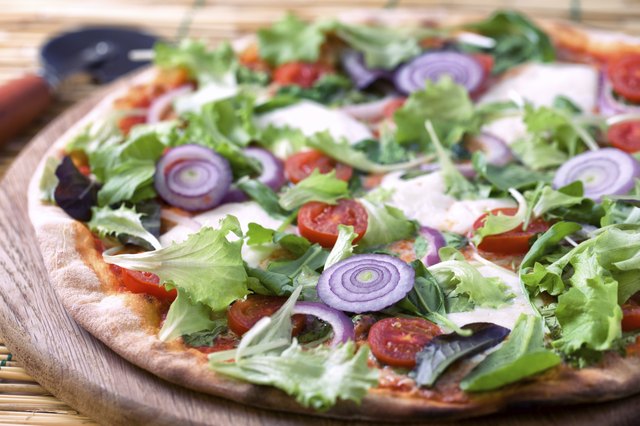 Pizza with salad and onion