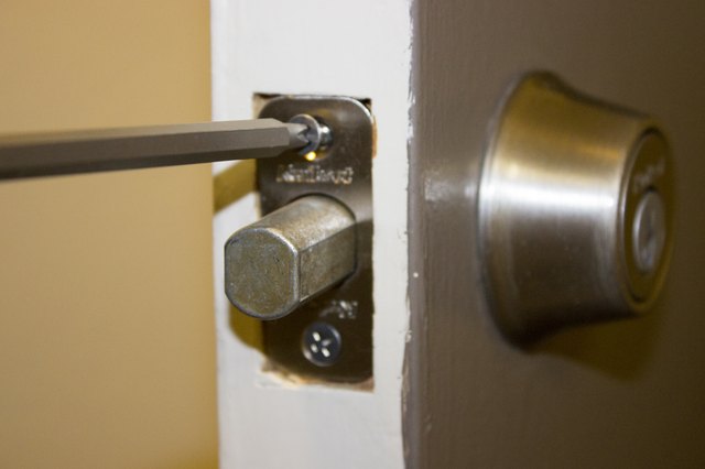 How to Remove a Schlage Deadbolt That Has No Visible Screw Heads | eHow