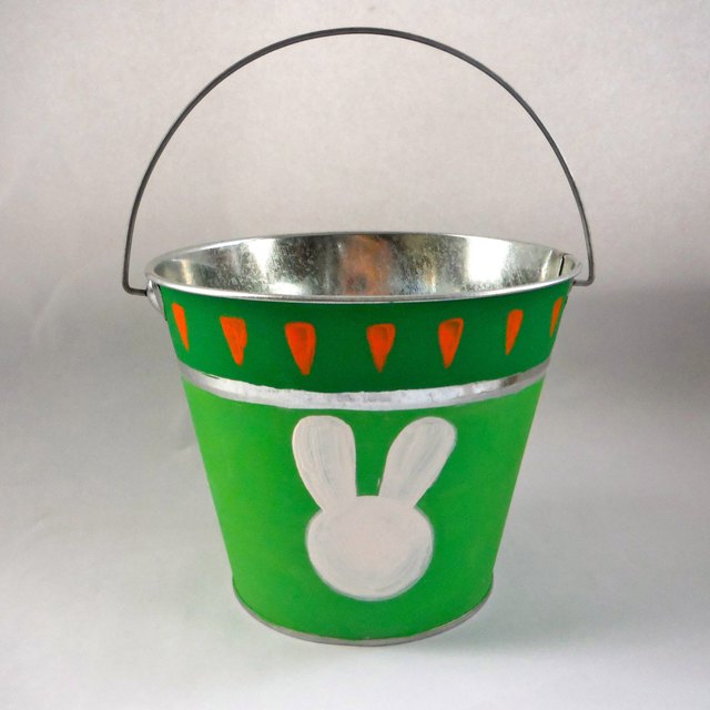 White rabbit, one foot on carrots