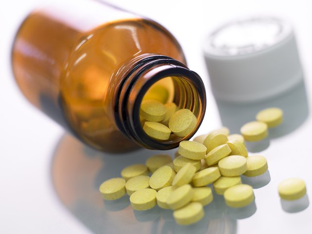 Pills spilling from bottle