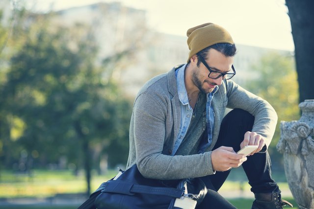 handsome man typing text message
