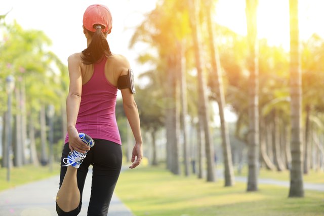 Runner athlete stretching legs