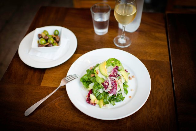 Plate of avocado salad on restaurant table