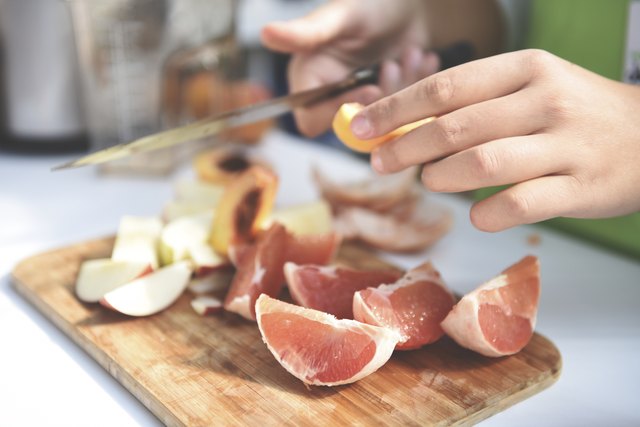 Professional chef preparing fruit salad