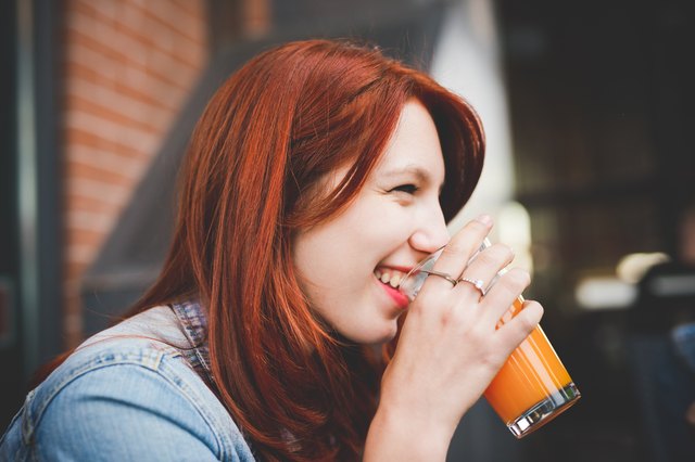 Half length of young handsome caucasian reddish hair woman drink