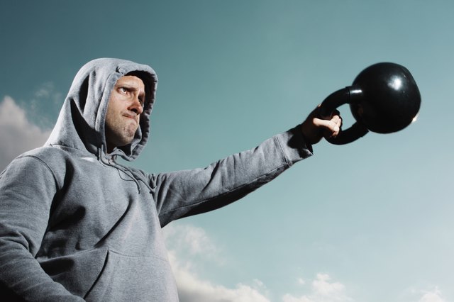 Man working out with kettlebell