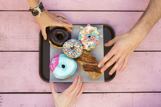Specialty doughnuts on a tray.