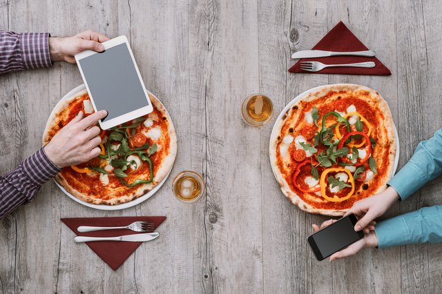 Friends eating pizza together