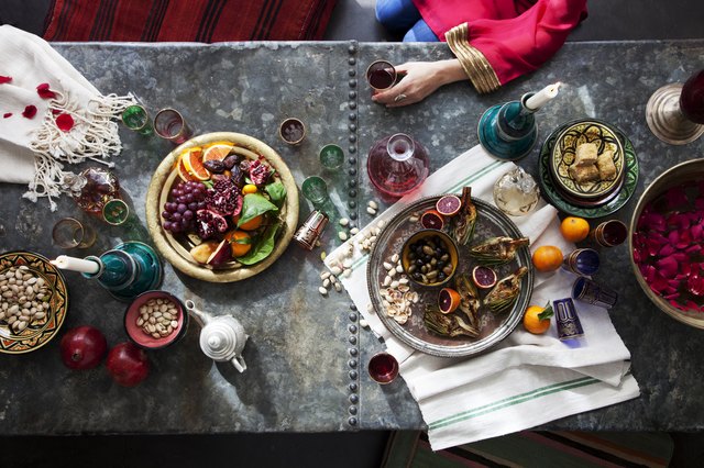 Overhead of woman sitting at Moroccan themed table
