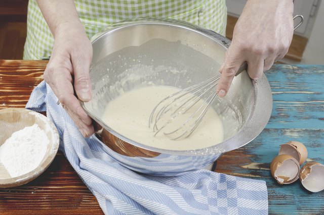 Woman making pancake batter