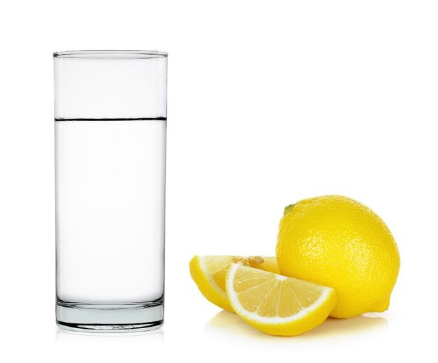 Water of glass with lemon isolated on the white background