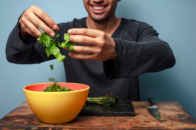 Young man is a happy salad tosser