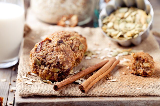 Oat and peanut butter cookies with pumpkin seeds,cinnamon,milk.