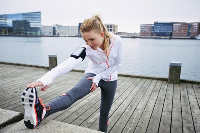 Female runner stretching before a run
