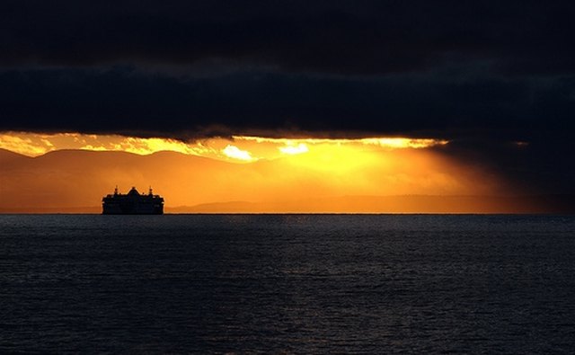 Supertanker approaching head on. Note the red light on the port side.