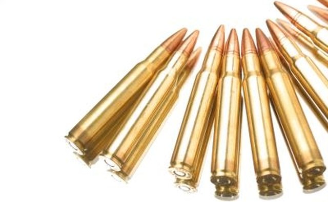 The primers are visible on these rifle cartridges